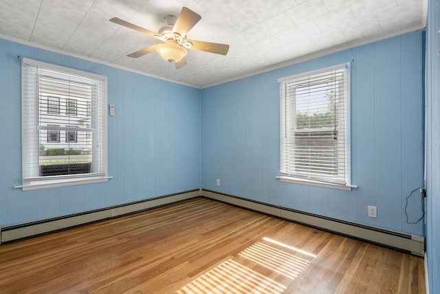 5 Ethel St, Blackstone, MA 01504 - spare room featuring wood finished floors, a baseboard radiator, crown molding, and ceiling fan