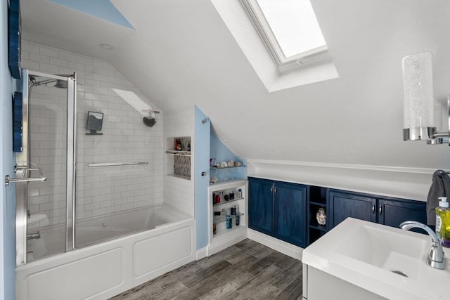 5 Ethel St, Blackstone, MA 01504 - bathroom featuring a skylight, vaulted ceiling, wood finished floors, shower / bath combination with glass door, and vanity