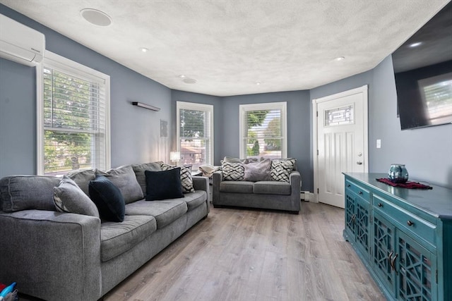 5 Ethel St, Blackstone, MA 01504 - living room with a wall mounted AC, light wood-style floors, recessed lighting, and baseboard heating
