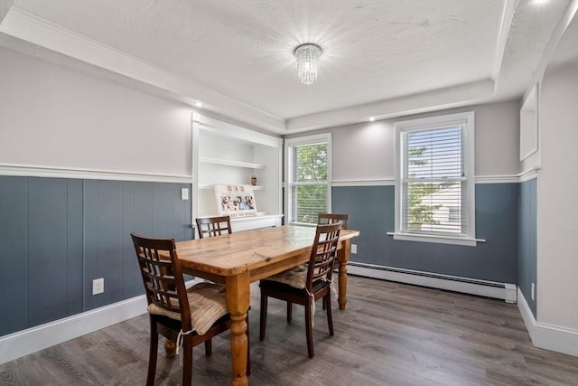 5 Ethel St, Blackstone, MA 01504 - dining space with baseboard heating, wood finished floors, a tray ceiling, and wainscoting