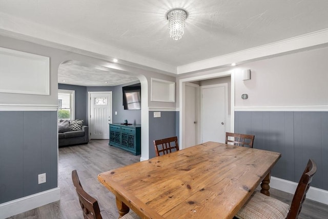 5 Ethel St, Blackstone, MA 01504 - dining space with arched walkways, wood finished floors, a wainscoted wall, and baseboards