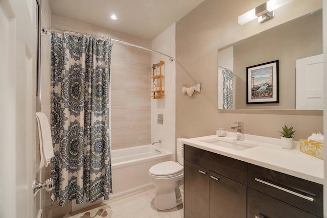 bathroom with vanity, toilet, shower / tub combo with curtain, and tile patterned flooring