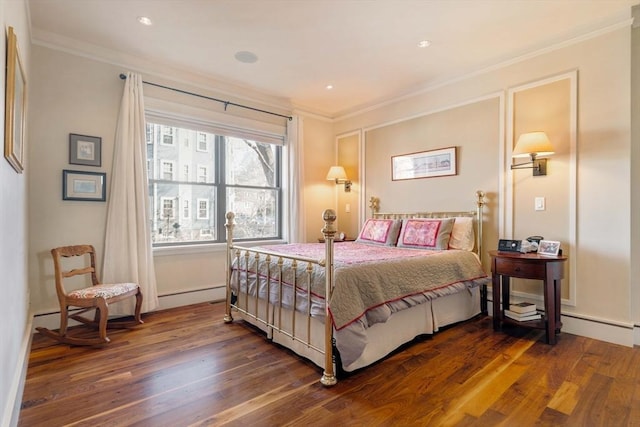 bedroom featuring dark wood finished floors and crown molding