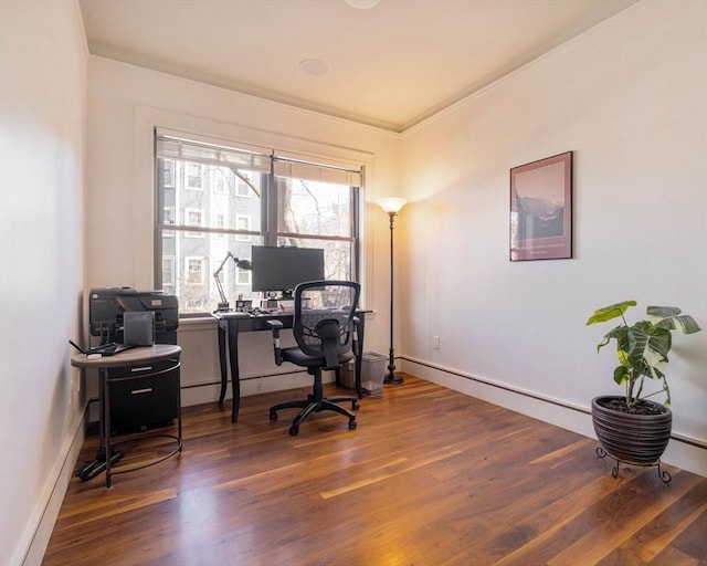 office featuring wood finished floors, baseboards, and ornamental molding