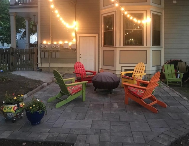 view of patio / terrace with an outdoor fire pit and fence