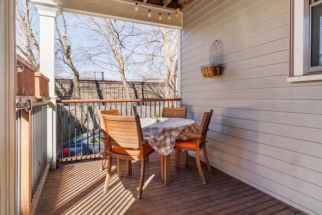 wooden deck with outdoor dining space