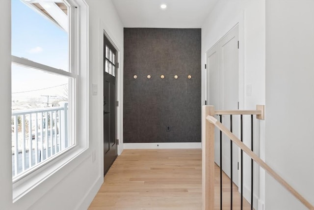 hall with light hardwood / wood-style floors