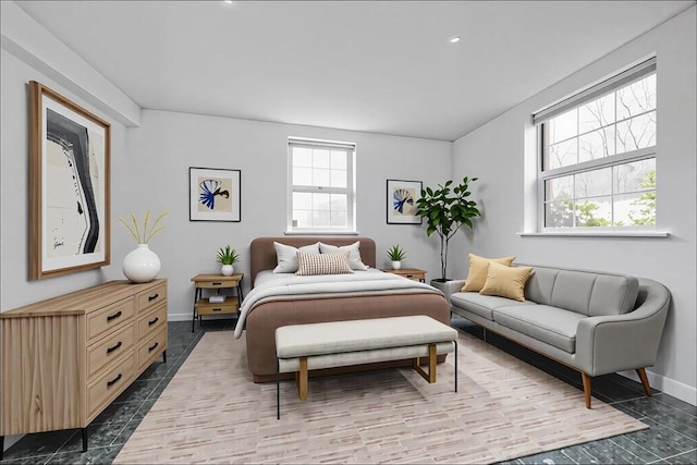 tiled bedroom featuring baseboards