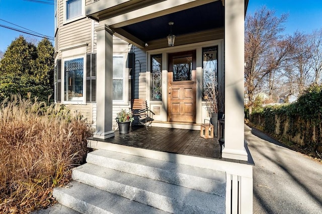 property entrance with covered porch