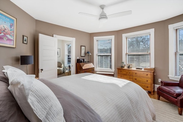 bedroom featuring hardwood / wood-style flooring and ceiling fan