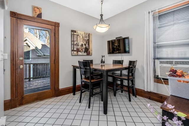 dining area featuring light tile patterned floors