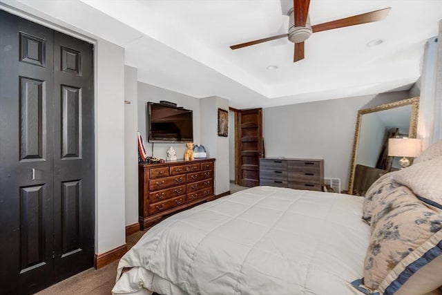 carpeted bedroom with a closet and ceiling fan