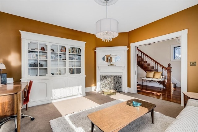 interior space with light colored carpet and an inviting chandelier