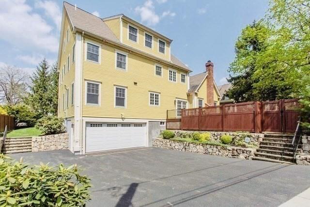 view of side of property with a garage