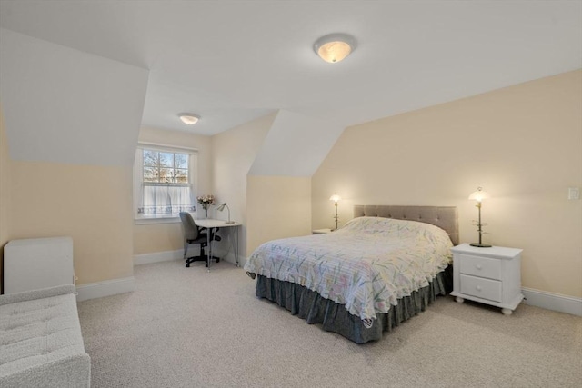 bedroom featuring carpet floors and vaulted ceiling