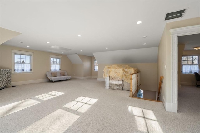 bonus room featuring lofted ceiling and light carpet