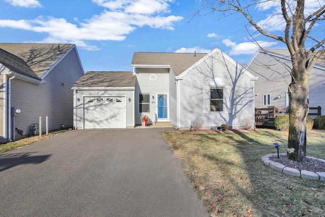 view of front facade with a front yard and a garage