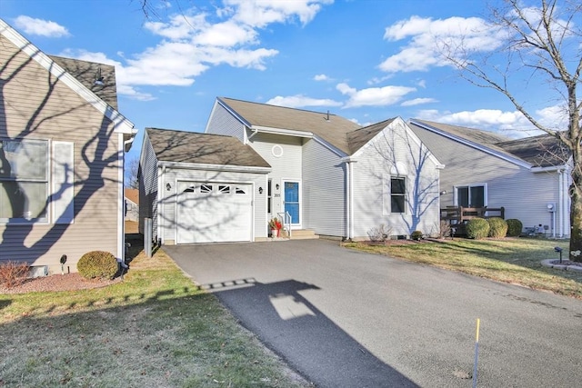 view of front of house with a front lawn and a garage