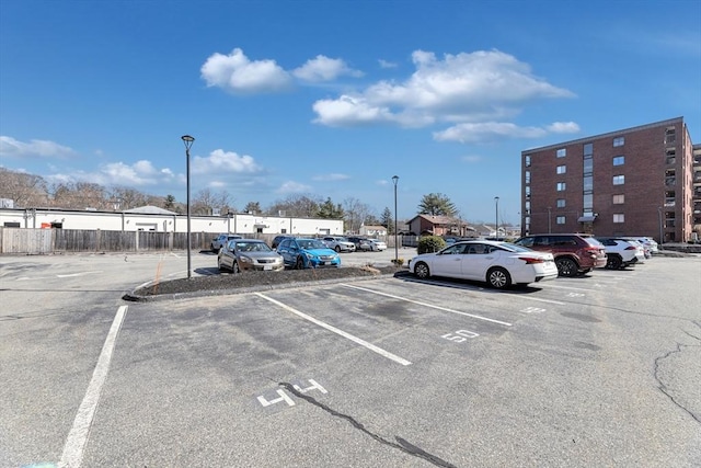 uncovered parking lot with fence