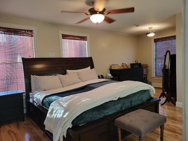 bedroom featuring hardwood / wood-style flooring and ceiling fan