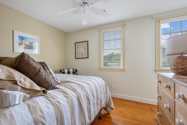 21 N Rd, Harwich, MA 02671 - bedroom with light wood-type flooring, a ceiling fan, and baseboards