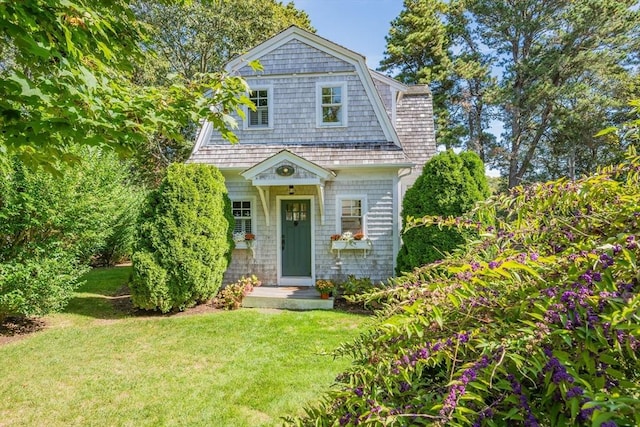 21 N Rd, Harwich, MA 02671 - view of front facade featuring a gambrel roof and a front lawn