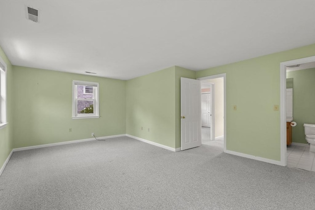 18 Harbor Hill Dr Unit 18, Bourne, MA 02532 - unfurnished bedroom featuring light carpet and ensuite bathroom