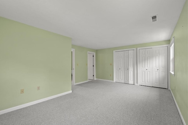 18 Harbor Hill Dr Unit 18, Bourne, MA 02532 - unfurnished bedroom with two closets and carpet floors
