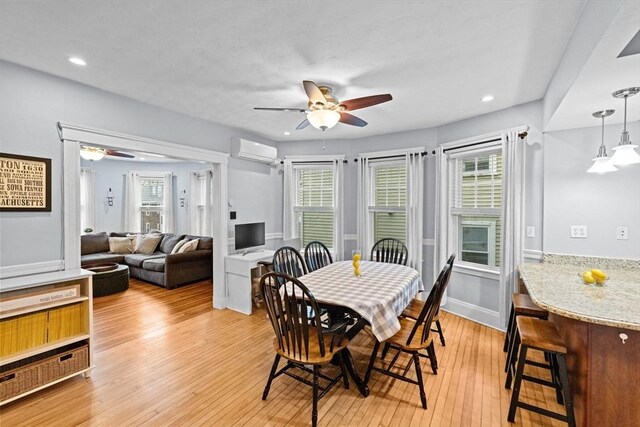 26 N Munroe Ter Unit 1, Boston, MA 02122 - dining space with ceiling fan, a wall mounted air conditioner, light wood finished floors, and recessed lighting