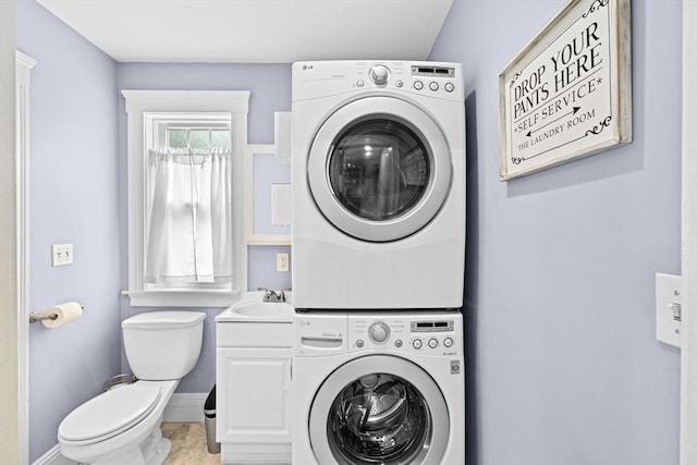 26 N Munroe Ter Unit 1, Boston, MA 02122 - laundry room with stacked washer / dryer and baseboards