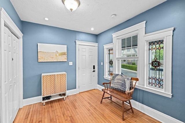26 N Munroe Ter Unit 1, Boston, MA 02122 - foyer with baseboards, healthy amount of natural light, and hardwood / wood-style floors