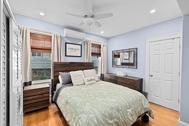 26 N Munroe Ter Unit 1, Boston, MA 02122 - bedroom with an AC wall unit, light wood finished floors, recessed lighting, and ceiling fan