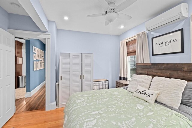 26 N Munroe Ter Unit 1, Boston, MA 02122 - bedroom featuring a wall unit AC, light wood-style flooring, baseboards, recessed lighting, and ceiling fan