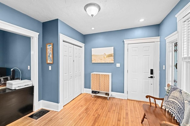 26 N Munroe Ter Unit 1, Boston, MA 02122 - entryway featuring baseboards, light wood finished floors, and recessed lighting
