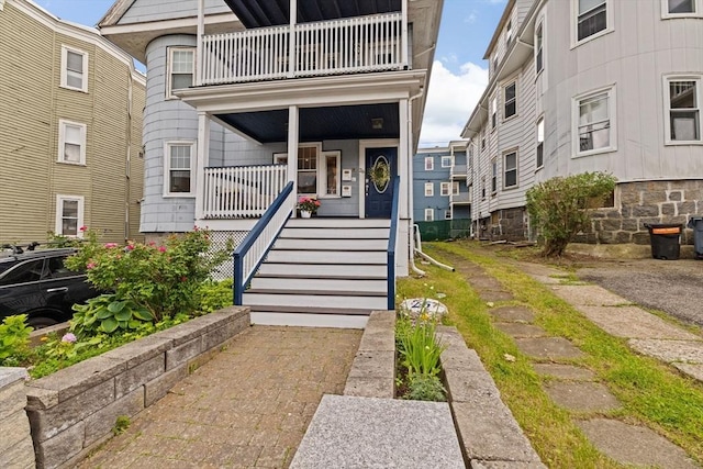 26 N Munroe Ter Unit 1, Boston, MA 02122 - doorway to property featuring a balcony and a porch