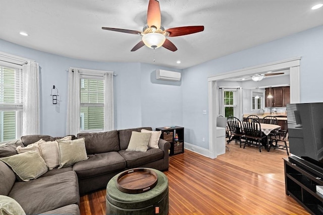 26 N Munroe Ter Unit 1, Boston, MA 02122 - living area featuring a wall mounted air conditioner, a ceiling fan, light wood-style flooring, plenty of natural light, and recessed lighting