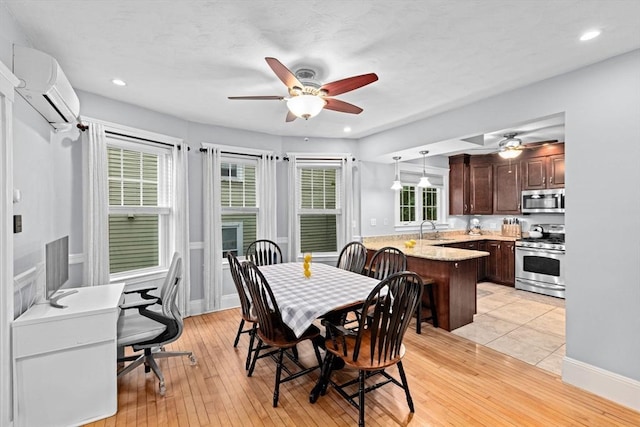 26 N Munroe Ter Unit 1, Boston, MA 02122 - dining space featuring a wall unit AC, a ceiling fan, light wood finished floors, and recessed lighting