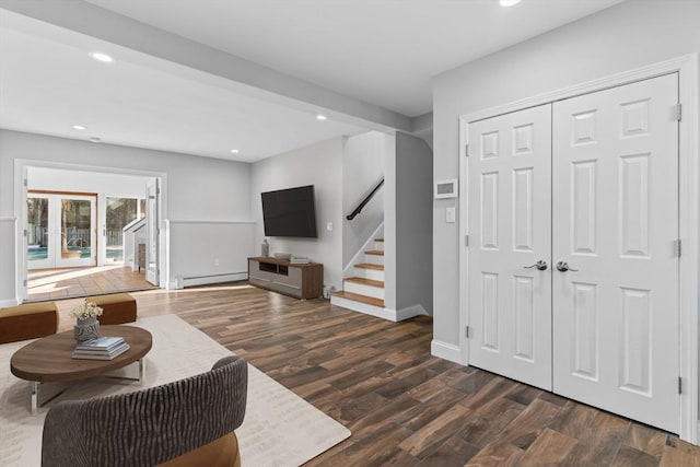 living room featuring dark hardwood / wood-style flooring and a baseboard radiator