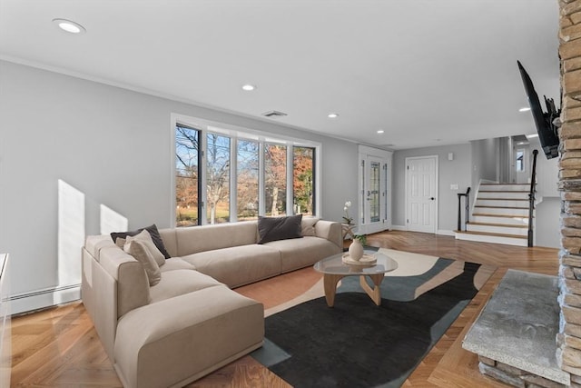 living room featuring french doors, light parquet floors, baseboard heating, and ornamental molding