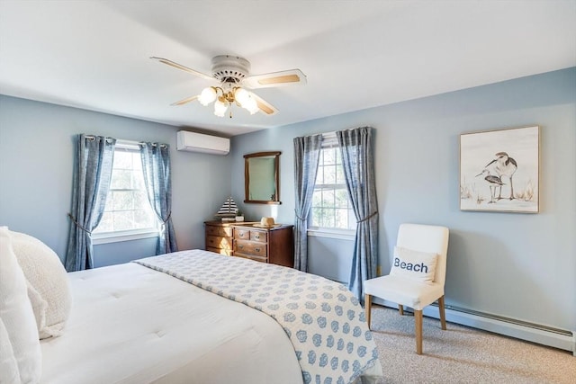 carpeted bedroom with a baseboard heating unit, a wall unit AC, and ceiling fan