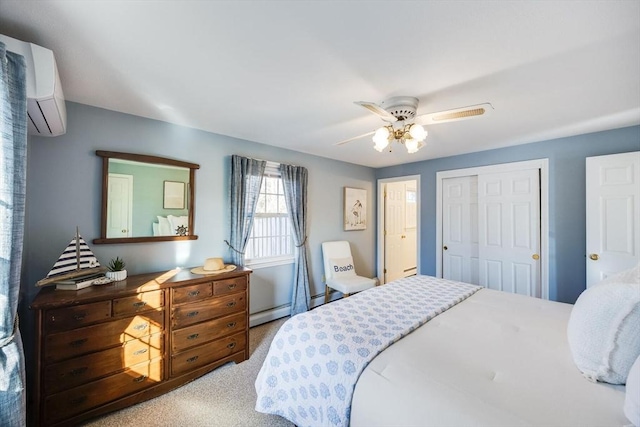 carpeted bedroom with ceiling fan, a baseboard heating unit, a closet, and an AC wall unit