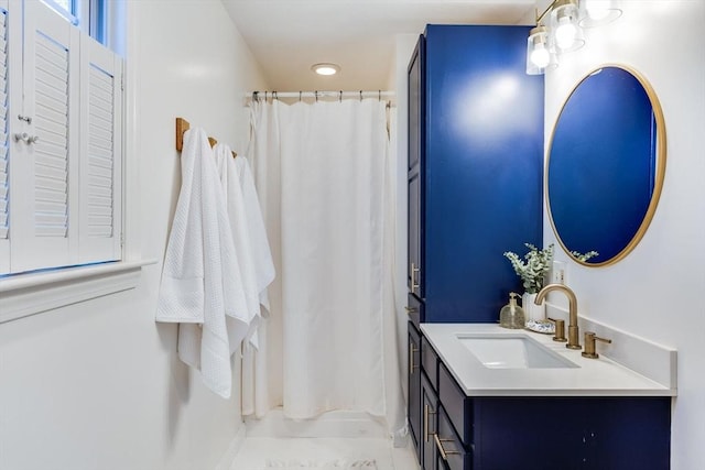 bathroom with a shower with curtain and vanity