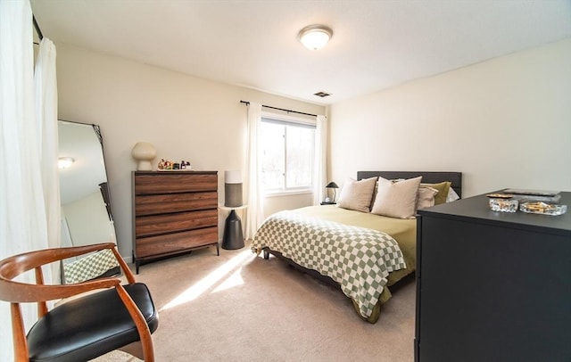 bedroom featuring carpet flooring and visible vents