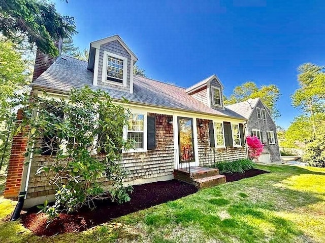 62 Teakettle Ln, Duxbury, MA 02332 - cape cod house featuring a front lawn and a chimney