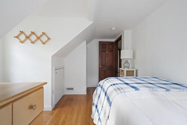 62 Teakettle Ln, Duxbury, MA 02332 - bedroom with light wood-style flooring and vaulted ceiling
