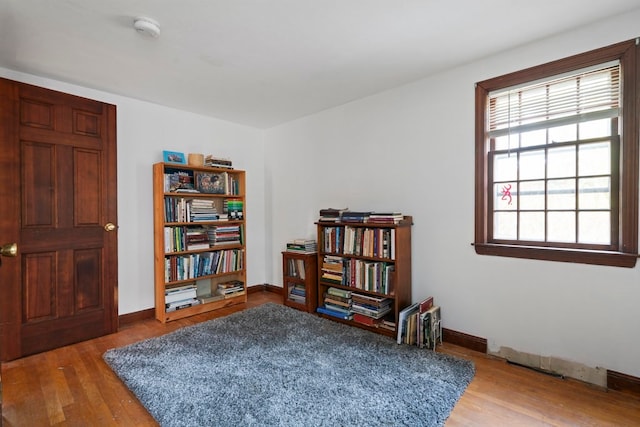 living area with hardwood / wood-style flooring