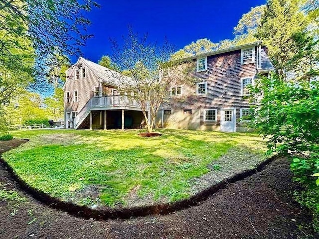 62 Teakettle Ln, Duxbury, MA 02332 - back of house featuring stairs, a wooden deck, and a lawn