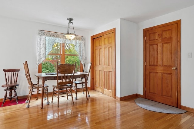 dining space with light wood-type flooring