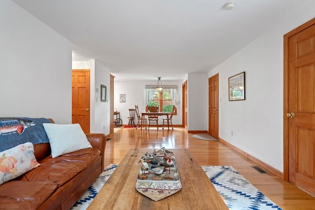 living room with light hardwood / wood-style floors