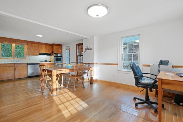 office area featuring light hardwood / wood-style flooring and sink